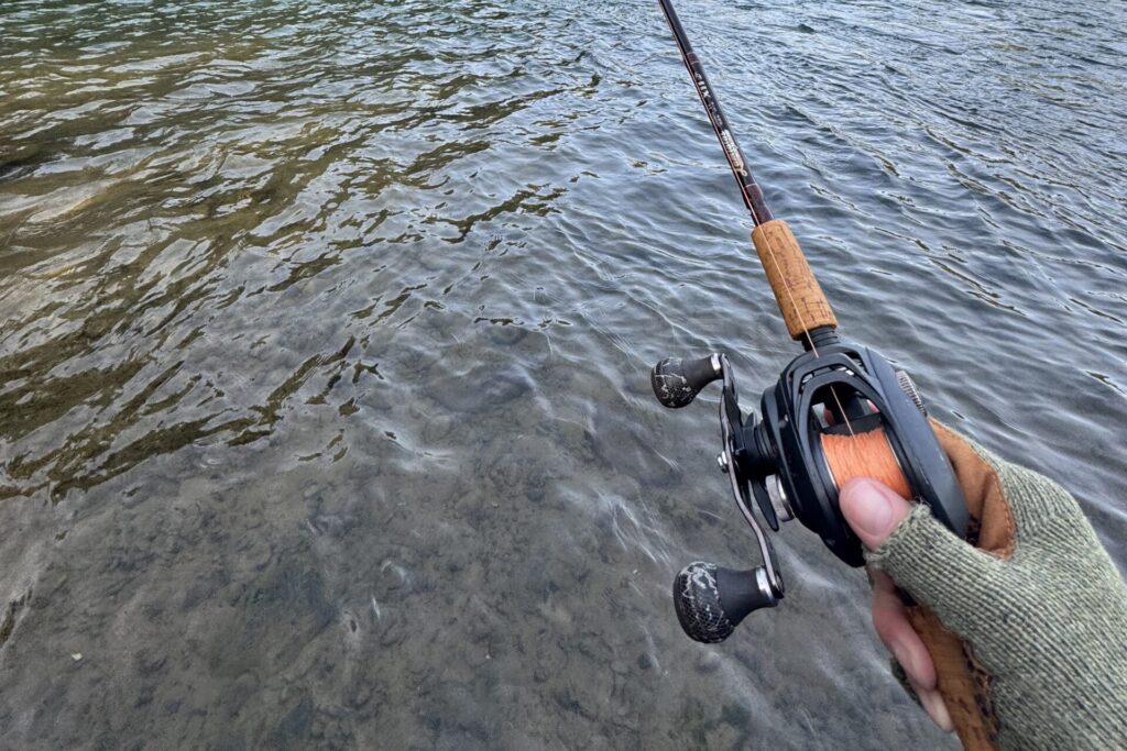 Fishing for Chinook salmon in a Pacific Northwest river using a rod, reel, and high-visibility braided line