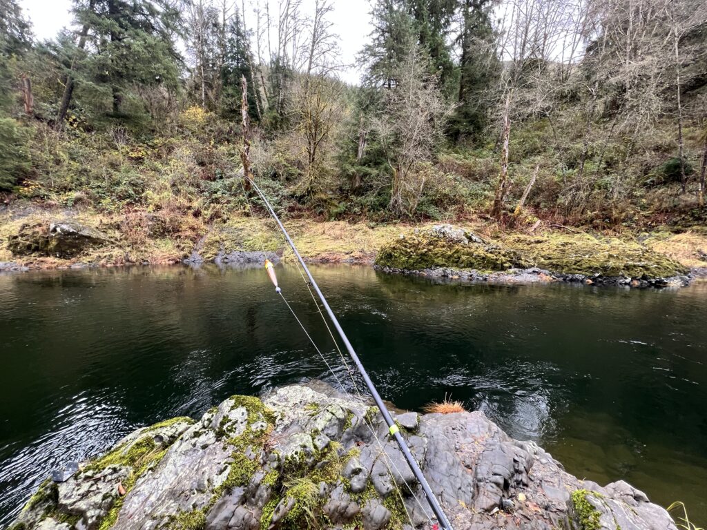 bank fishing for salmon in Oregon river with float setup