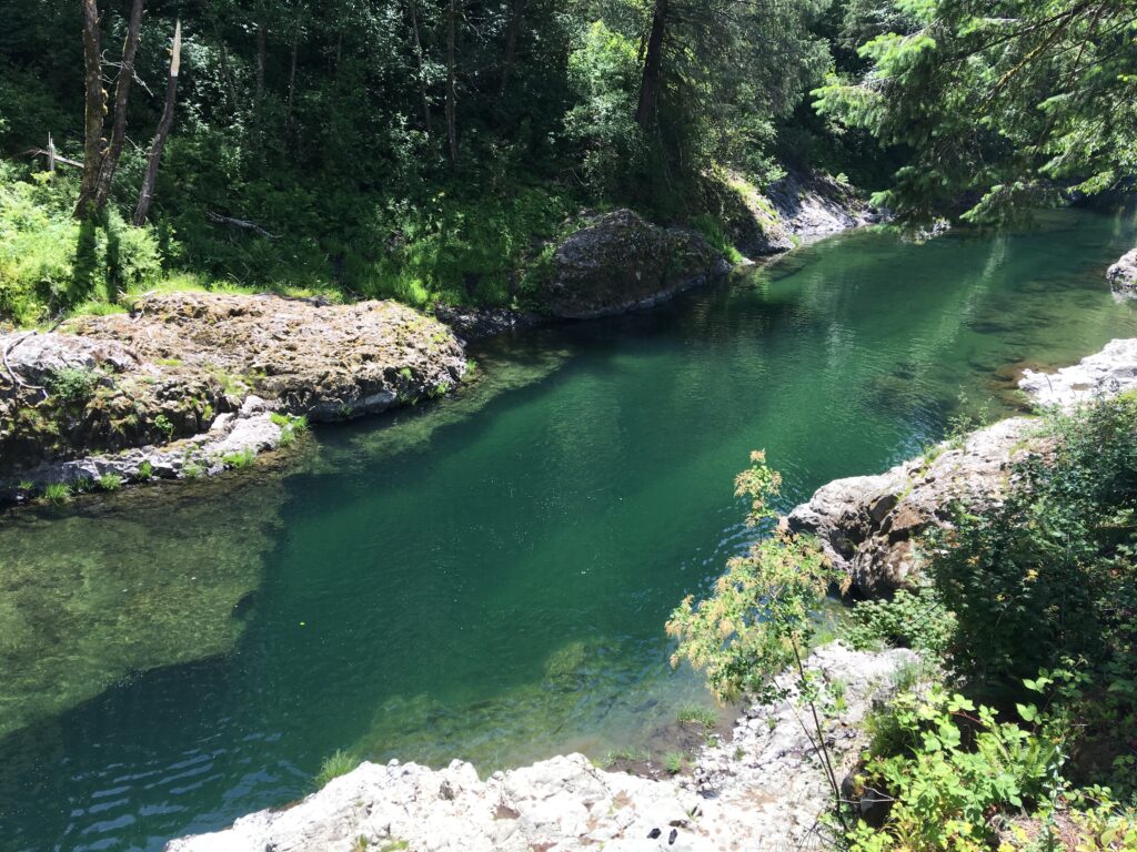 deep river pool with rocks creating salmon holding water near structure